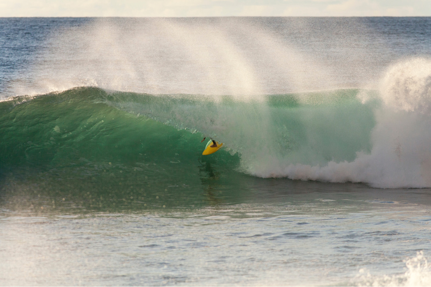 Surfer riding a crystal wave the surf guide in madeira gave advice on