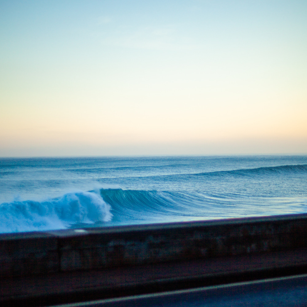 Crystal blue waves that are perfect for surfers to ride after getting the advice from a surf guide in madeira