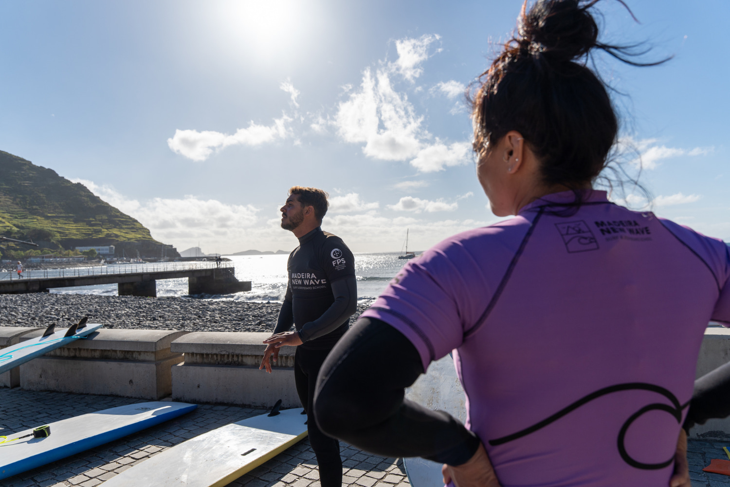 Instructor sharing tips with the bodyboarders who are about to start a group bodyboard lesson in madeira