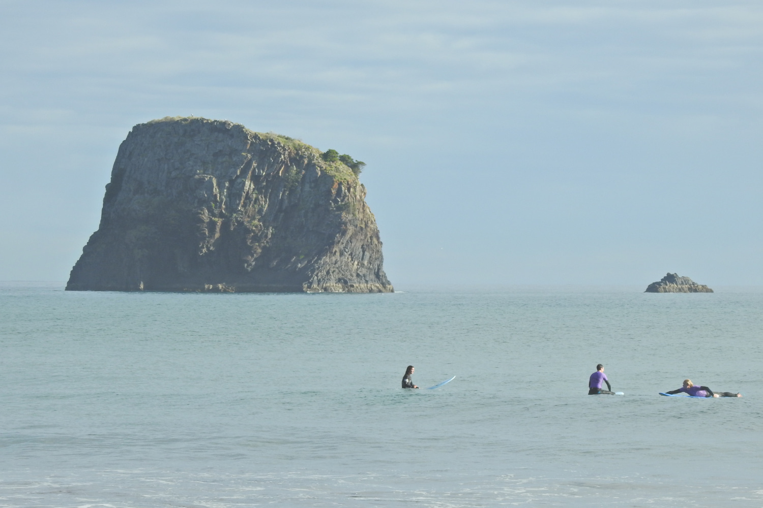 Group of surfers doing a group surf lesson in Porto da Cruz