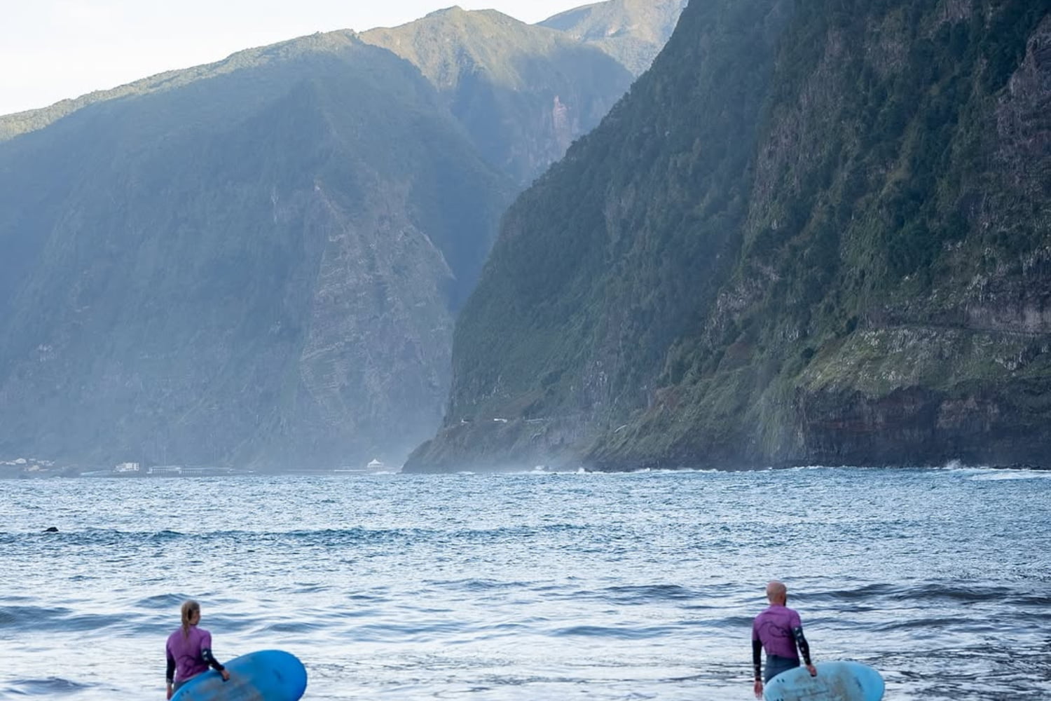 Surfers in seixal beach while doing a surf lesson